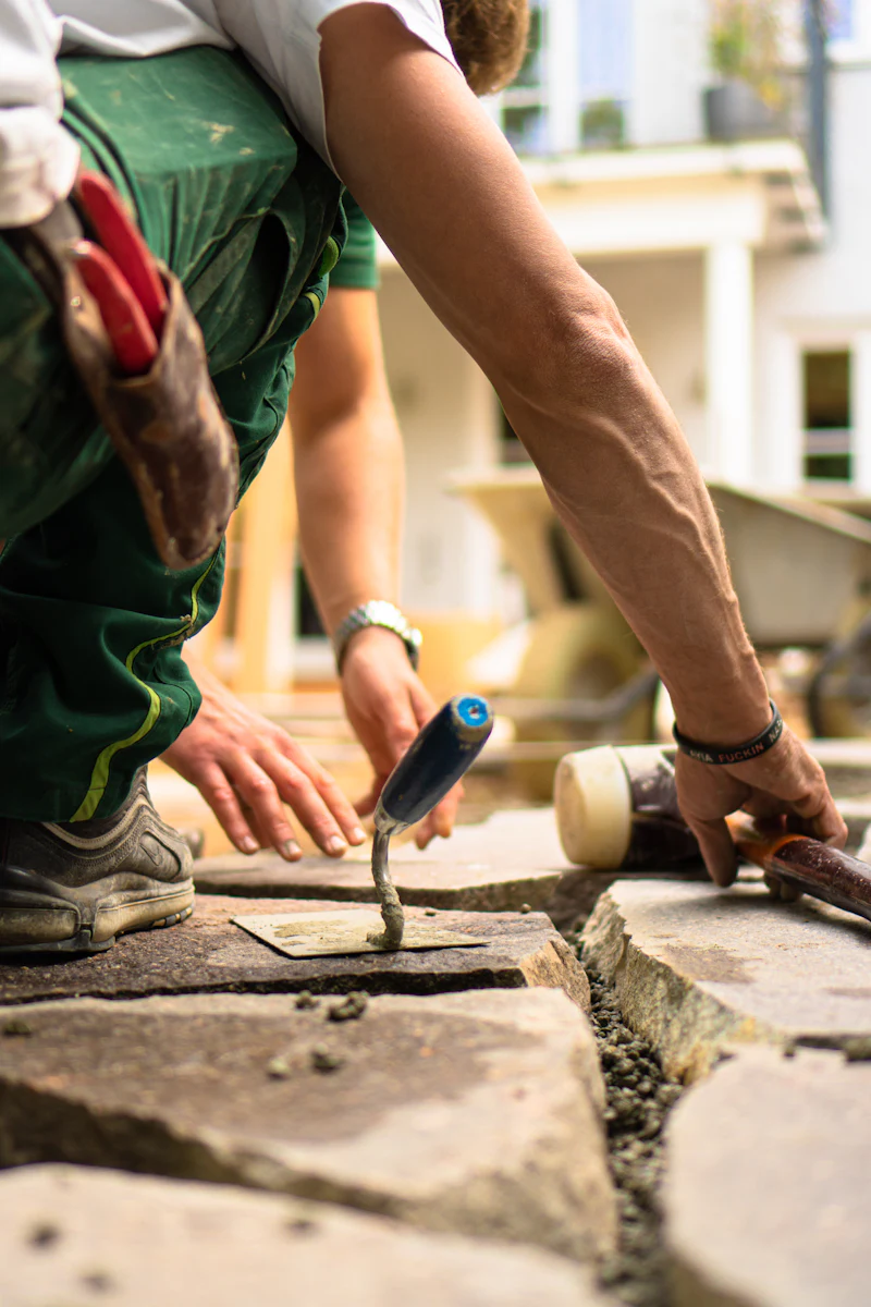 Hand troweling and edging fresh concrete